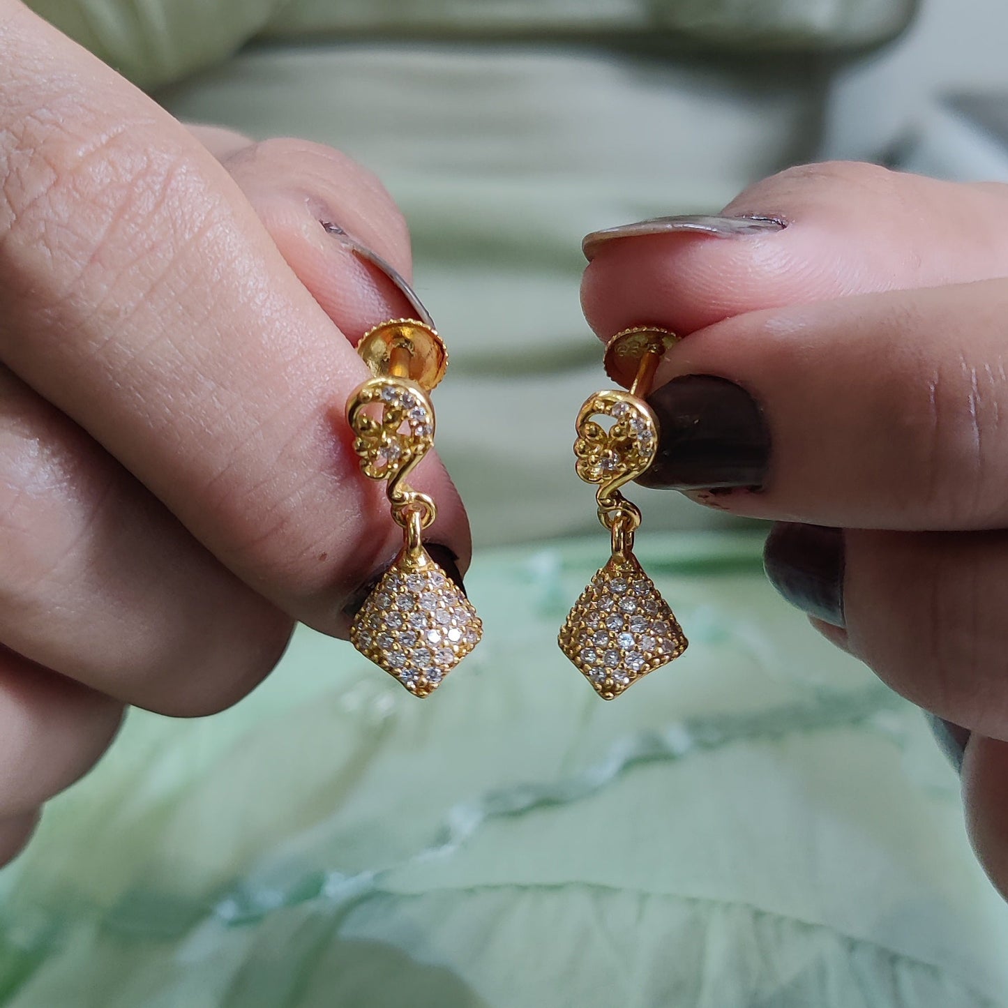 Golden Grace: Pure Silver Jhumkas with a Luxurious Touch