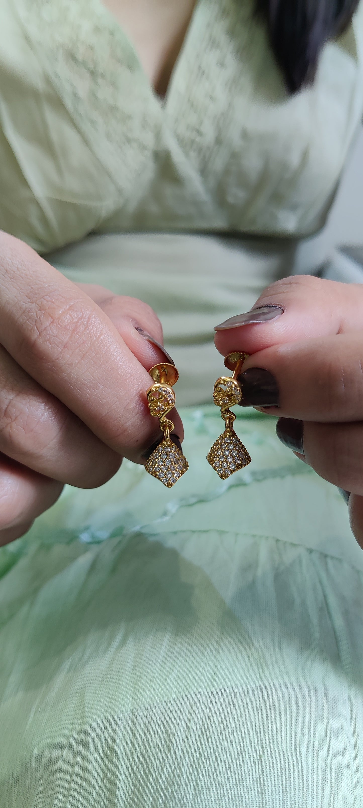 Golden Grace: Pure Silver Jhumkas with a Luxurious Touch