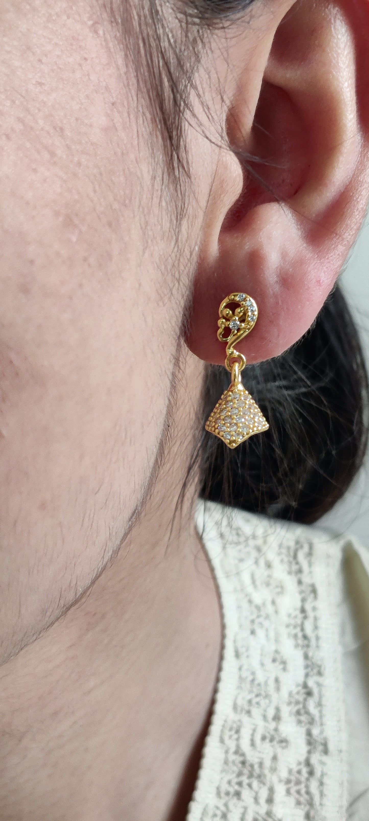 Golden Grace: Pure Silver Jhumkas with a Luxurious Touch