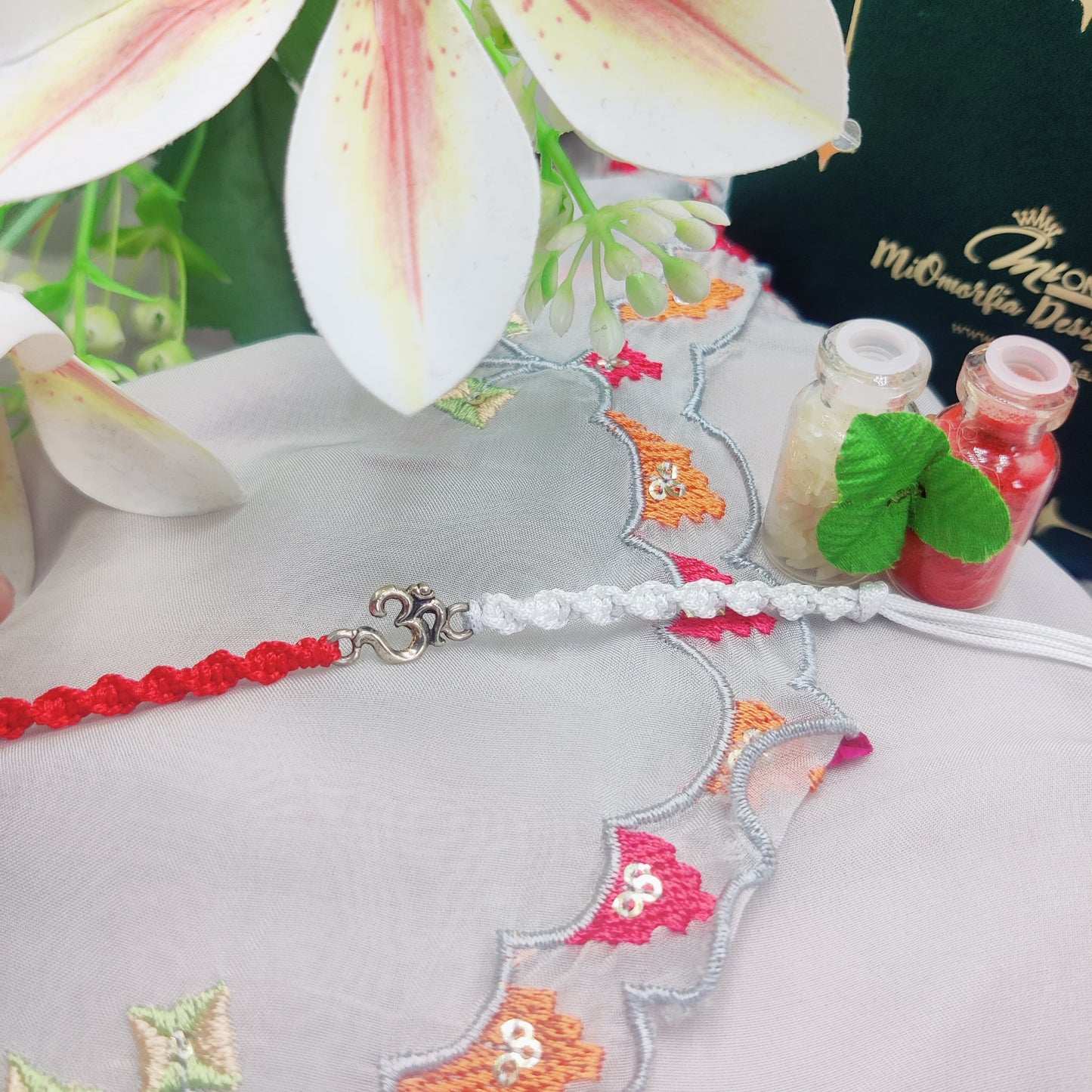 Om Divine Bond Silver Rakhi
