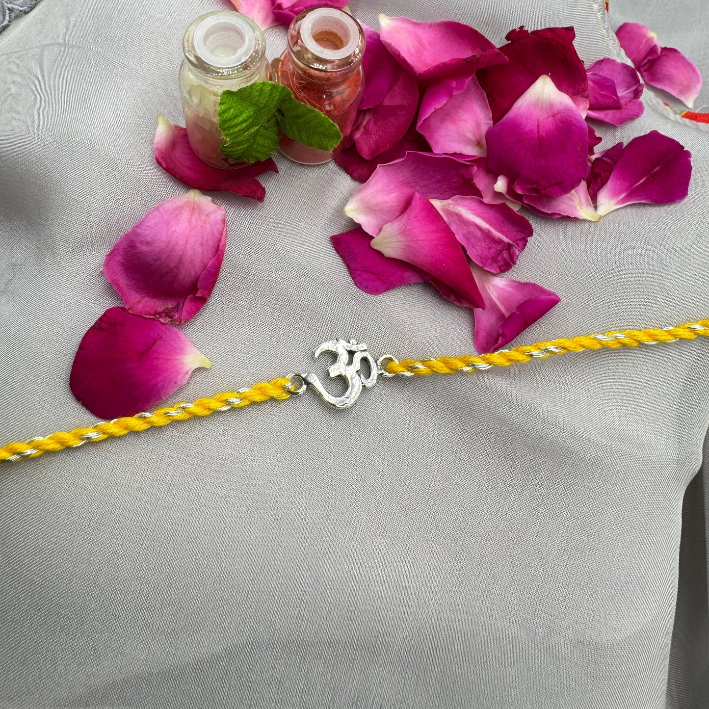 Om Silver Rakhi in Pure silver